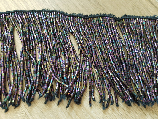 Perlenkette mit Strängen aus schwarzem Perlmutt mit vielen Perlen

 1 Meter lang, Stränge 30cm lang